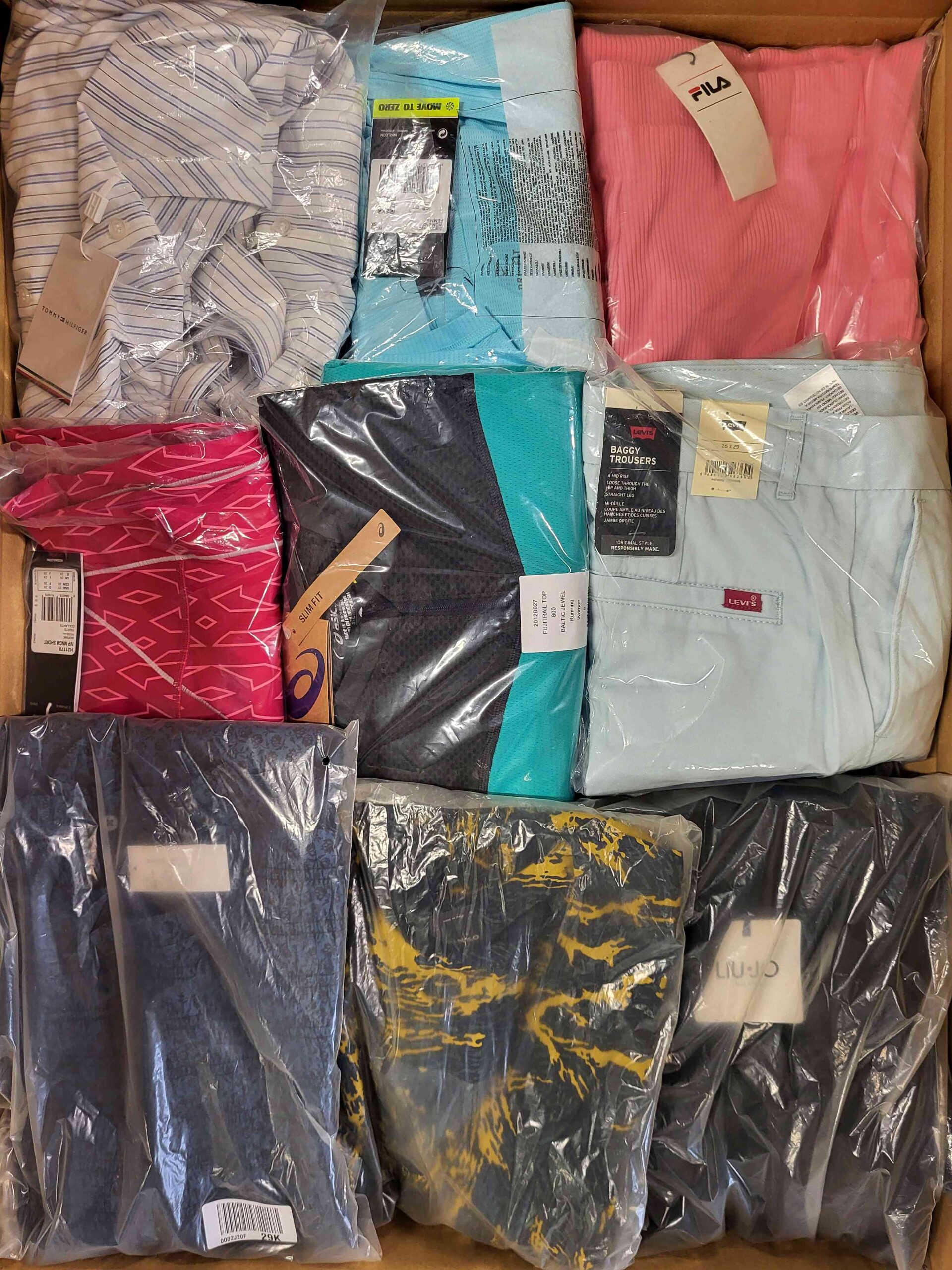 The photo shows a package with clothing in the category AW.