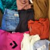 The photo shows a package with clothing in the category U.
