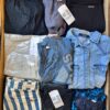 The photo shows a package with clothing in the category U.