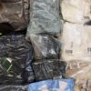 The photo shows a package with clothing in the category D.
