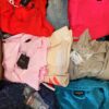 The photo shows a package with clothing in the category T.