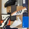 The photo shows a package with footwear in the category BS.