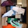 The photo shows a package with footwear in the category BS.