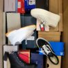 The photo shows a package with footwear in the category BS.