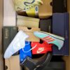 The photo shows a package with footwear in the category BS.