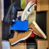 The photo shows a package with footwear in the category BS.