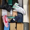 The photo shows a package with footwear in the category BS.