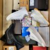 The photo shows a package with footwear in the category BS.