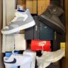 The photo shows a package with footwear in the category BS.