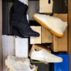 The photo shows a package with footwear in the category BS.