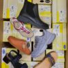 The photo shows a package with footwear in the category SM.