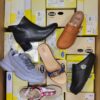 The photo shows a package with footwear in the category SM.