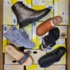 The photo shows a package with footwear in the category SM.