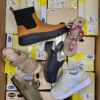 The photo shows a package with footwear in the category SM.