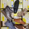 The photo shows a package with footwear in the category SM.