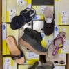 The photo shows a package with footwear in the category SM.