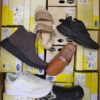 The photo shows a package with footwear in the category SM.