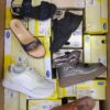 The photo shows a package with footwear in the category SM.