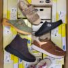 The photo shows a package with footwear in the category SM.