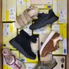 The photo shows a package with footwear in the category SM.