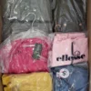 The photo shows a package with clothing in the category AJS.