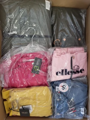 The photo shows a package with clothing in the category AJS.