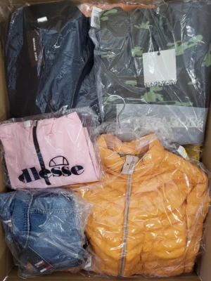 The photo shows a package with clothing in the category AJS.