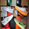 The photo shows a package with footwear in the category CS.