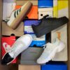 The photo shows a package with footwear in the category CS.
