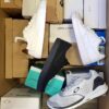 The photo shows a package with footwear in the category CS.