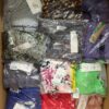 The photo shows a package with clothing in the category AR.