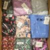 The photo shows a package with clothing in the category AR.