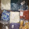 The photo shows a package with clothing in the category AR.
