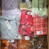 The photo shows a package with clothing in the category AR.