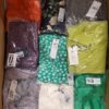 The photo shows a package with clothing in the category AR.
