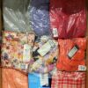 The photo shows a package with clothing in the category AR.