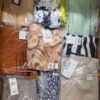 The photo shows a package with clothing in the category AR.