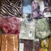 The photo shows a package with clothing in the category AR.