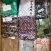 The photo shows a package with clothing in the category AR.