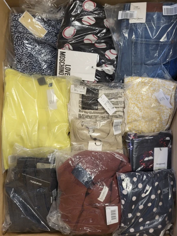 The photo shows a package with clothing in the category AW.
