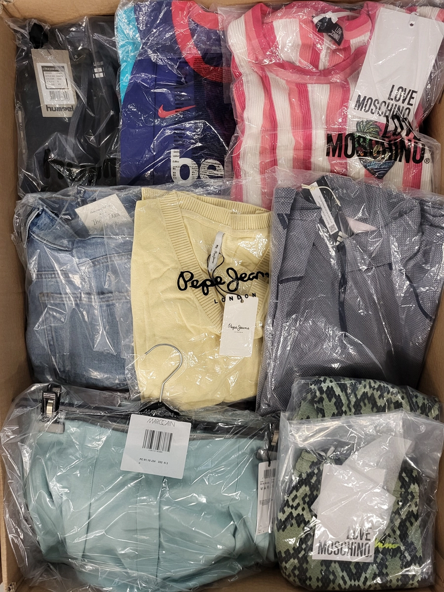The photo shows a package with clothing in the category AW.