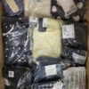 The photo shows a package with clothing in the category AW.