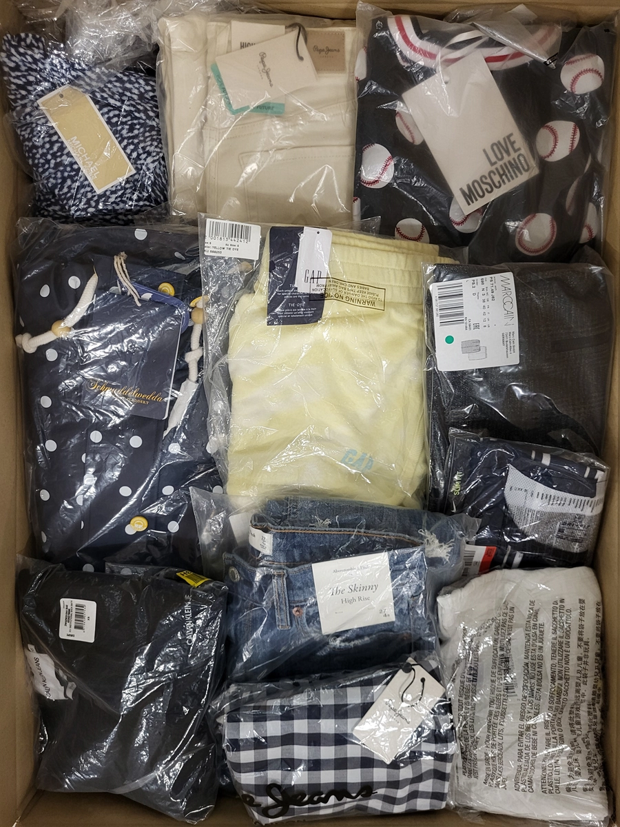 The photo shows a package with clothing in the category AW.
