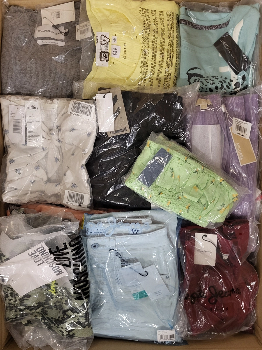 The photo shows a package with clothing in the category AW.