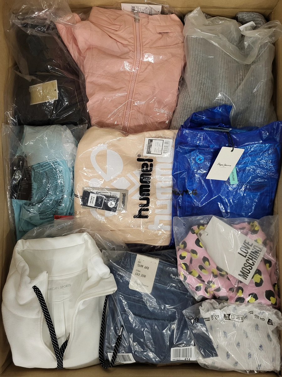 The photo shows a package with clothing in the category AW.