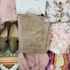The photo shows a package with clothing in the category SN.