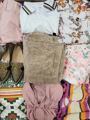 The photo shows a package with clothing in the category SN.