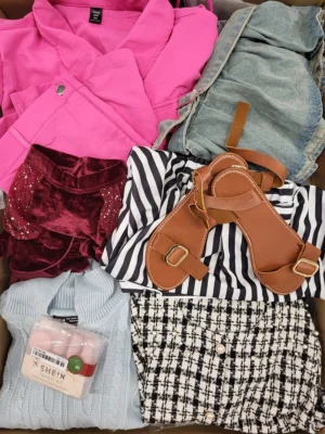 The photo shows a package with clothing in the category SN.