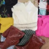 The photo shows a package with clothing in the category SN.