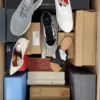 The photo shows a package with footwear in the category AS.